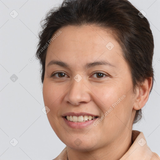 Joyful white young-adult female with short  brown hair and brown eyes