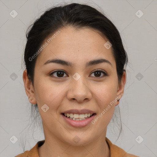 Joyful latino young-adult female with medium  brown hair and brown eyes