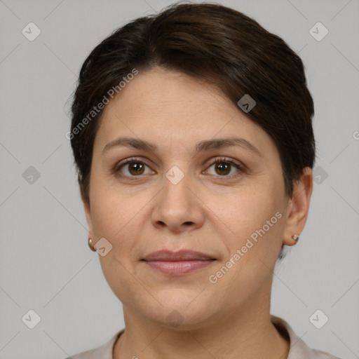 Joyful white adult female with short  brown hair and brown eyes