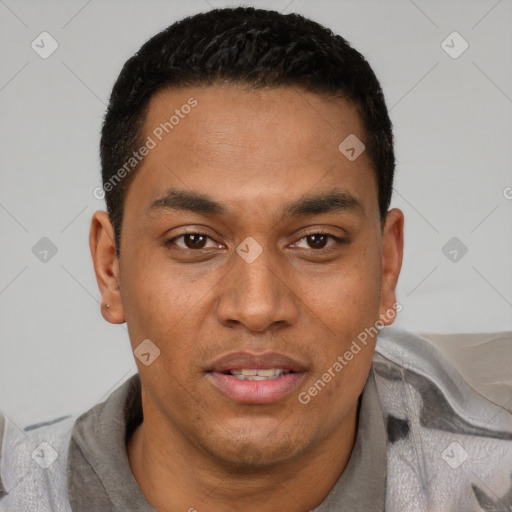 Joyful latino young-adult male with short  black hair and brown eyes