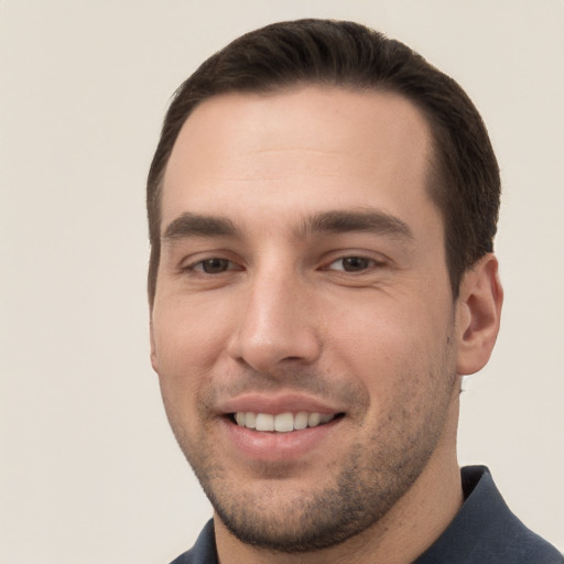 Joyful white young-adult male with short  brown hair and brown eyes