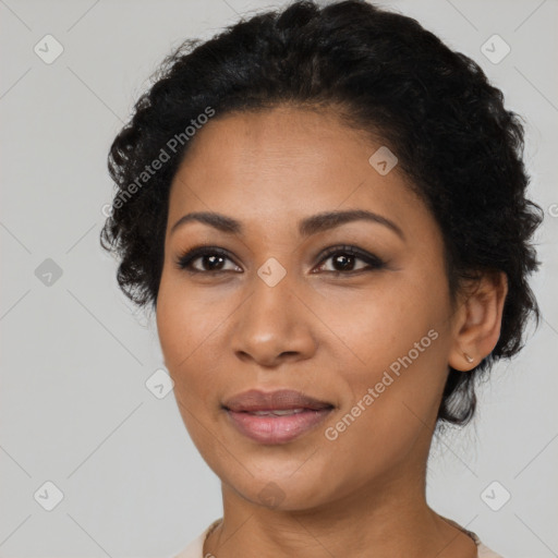 Joyful latino young-adult female with short  black hair and brown eyes