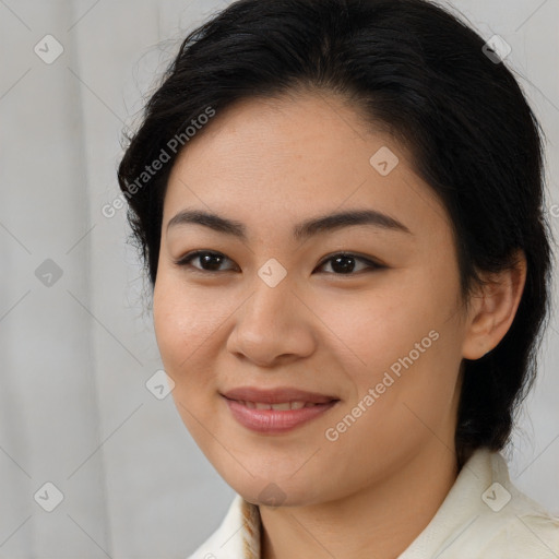 Joyful latino young-adult female with medium  brown hair and brown eyes