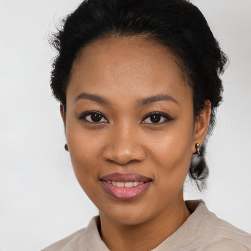 Joyful latino young-adult female with short  black hair and brown eyes