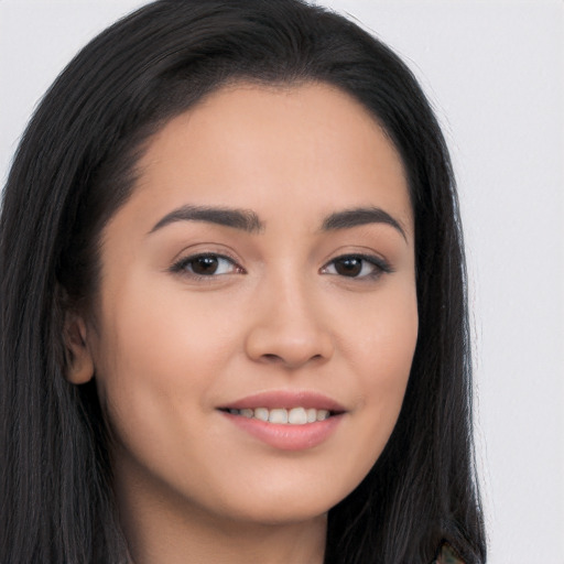 Joyful asian young-adult female with long  brown hair and brown eyes