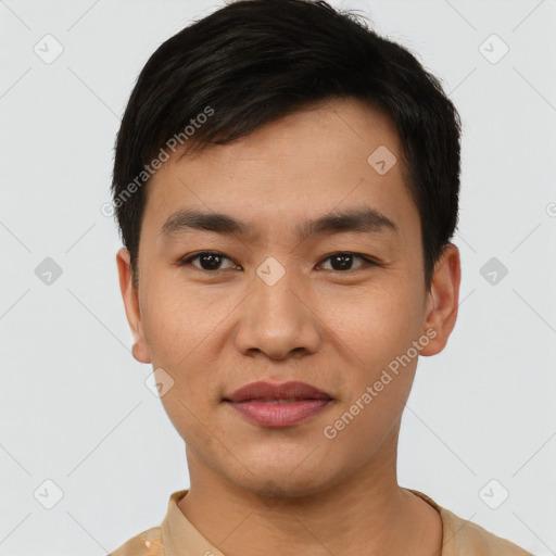 Joyful asian young-adult male with short  black hair and brown eyes