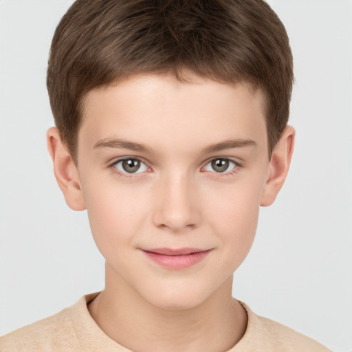 Joyful white child male with short  brown hair and brown eyes