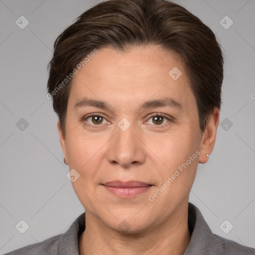 Joyful white adult female with short  brown hair and brown eyes