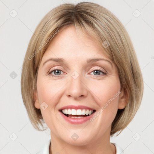 Joyful white young-adult female with medium  brown hair and blue eyes