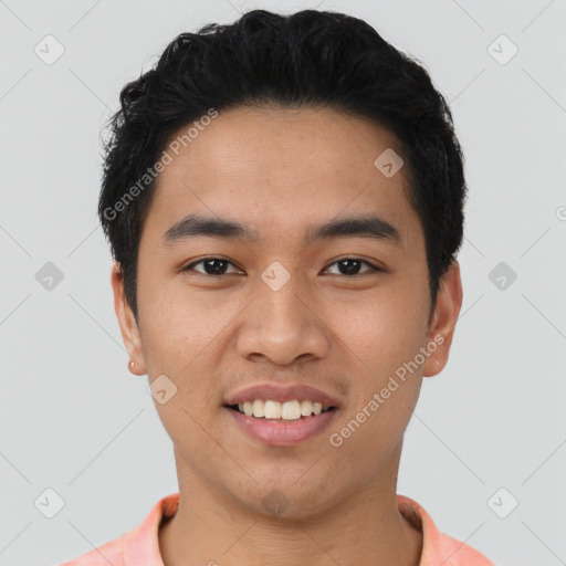 Joyful asian young-adult male with short  black hair and brown eyes