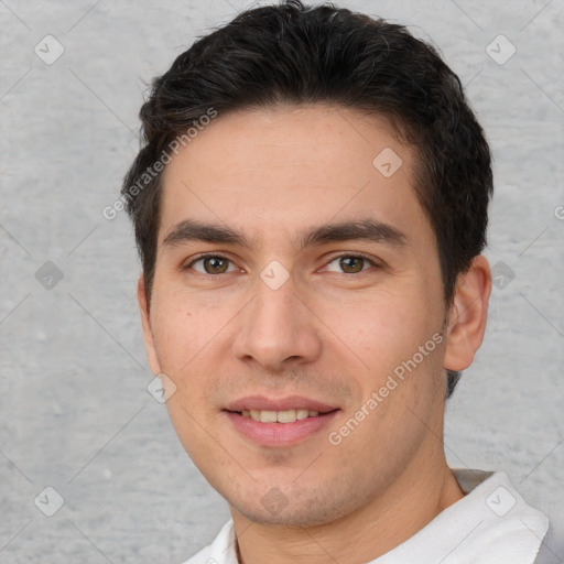 Joyful white young-adult male with short  brown hair and brown eyes