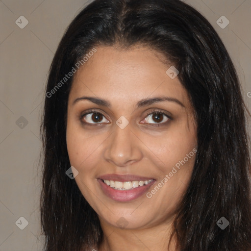 Joyful white young-adult female with long  brown hair and brown eyes