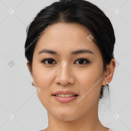 Joyful asian young-adult female with short  brown hair and brown eyes