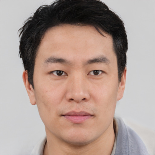 Neutral asian young-adult male with short  black hair and brown eyes