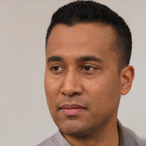 Neutral latino young-adult male with short  black hair and brown eyes