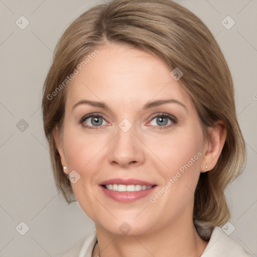 Joyful white adult female with medium  brown hair and grey eyes