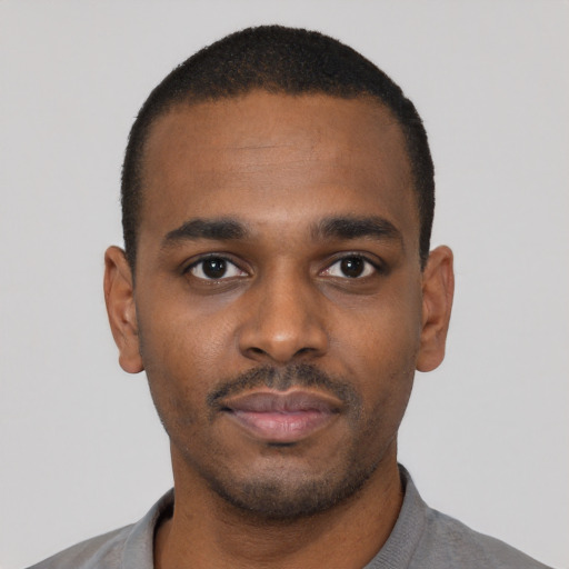 Neutral black young-adult male with short  black hair and brown eyes