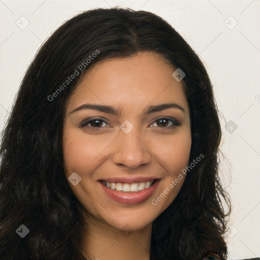 Joyful latino young-adult female with long  brown hair and brown eyes