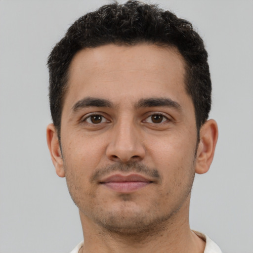Neutral latino young-adult male with short  brown hair and brown eyes