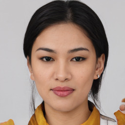 Joyful asian young-adult female with medium  black hair and brown eyes