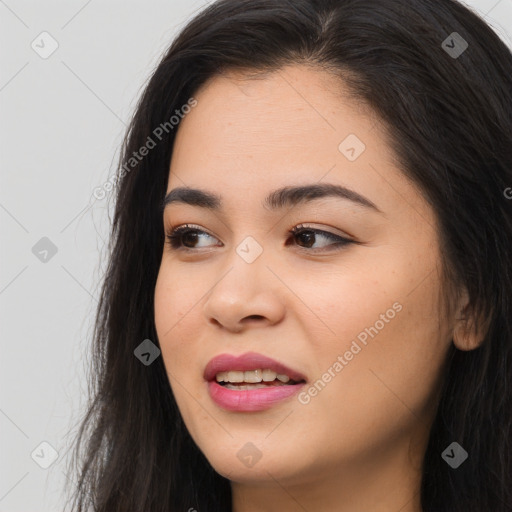 Joyful asian young-adult female with long  brown hair and brown eyes