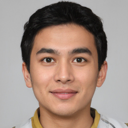 Joyful asian young-adult male with short  black hair and brown eyes