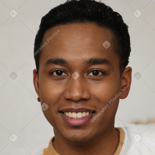 Joyful black young-adult male with short  black hair and brown eyes