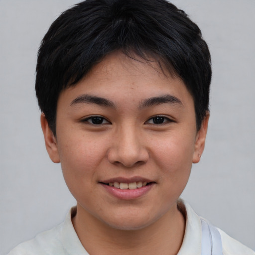 Joyful asian young-adult female with short  brown hair and brown eyes