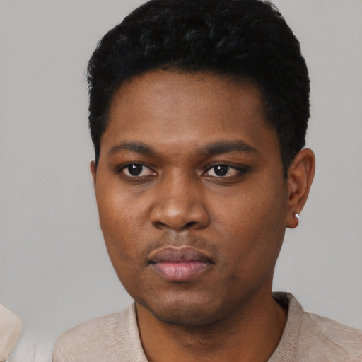 Neutral black young-adult male with short  black hair and brown eyes