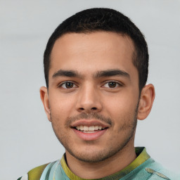 Joyful white young-adult male with short  black hair and brown eyes
