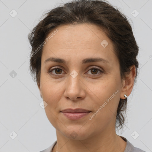 Joyful white adult female with short  brown hair and brown eyes