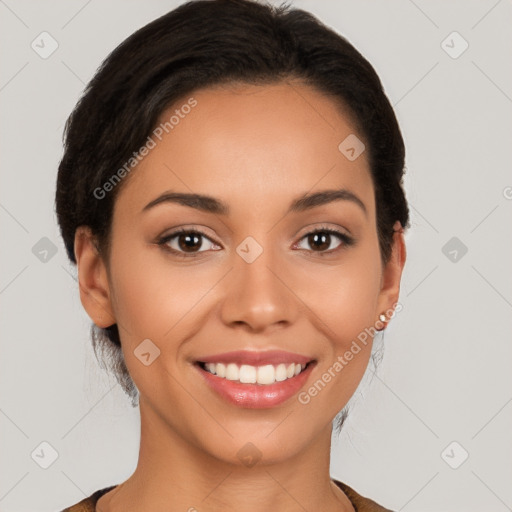 Joyful latino young-adult female with short  black hair and brown eyes