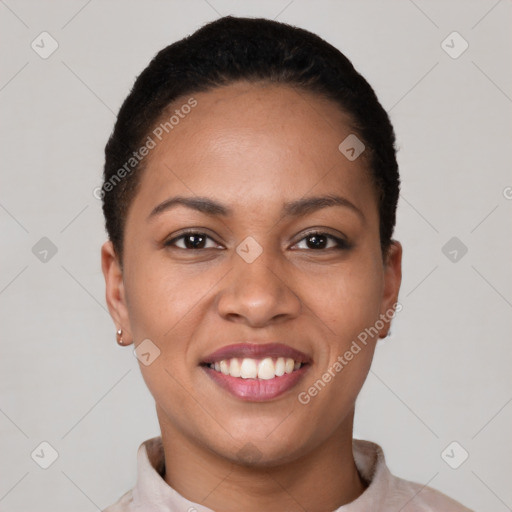 Joyful latino young-adult female with short  black hair and brown eyes