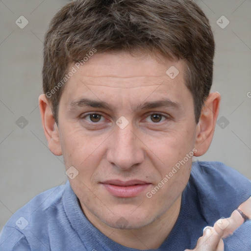 Joyful white adult male with short  brown hair and grey eyes