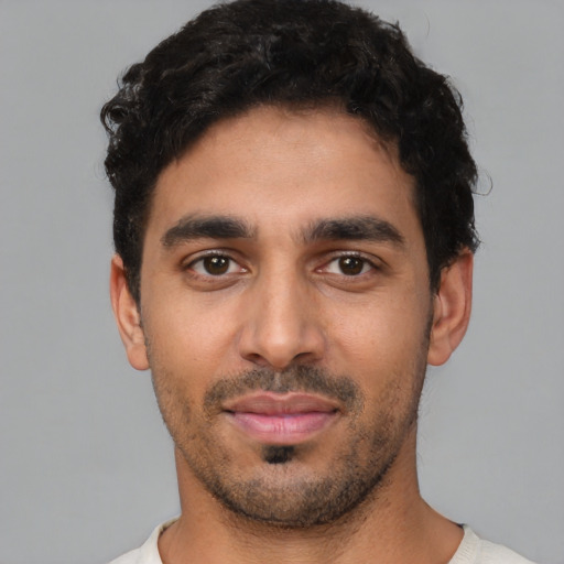 Neutral latino young-adult male with short  black hair and brown eyes