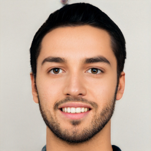 Joyful latino young-adult male with short  black hair and brown eyes