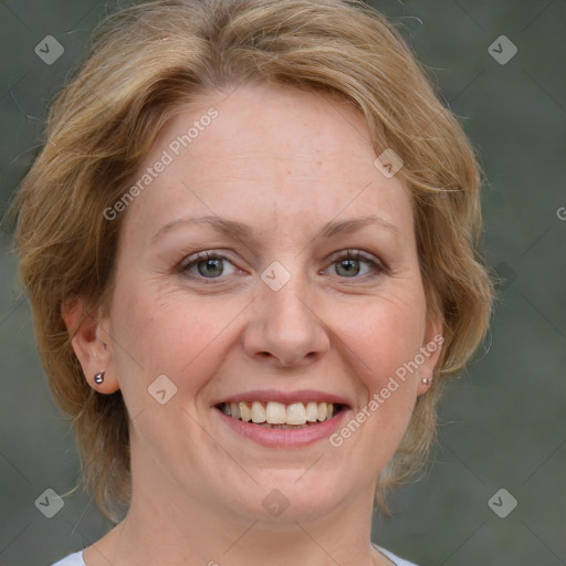 Joyful white adult female with medium  brown hair and blue eyes