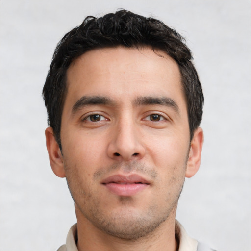 Neutral white young-adult male with short  black hair and brown eyes