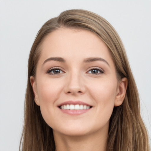 Joyful white young-adult female with long  brown hair and grey eyes