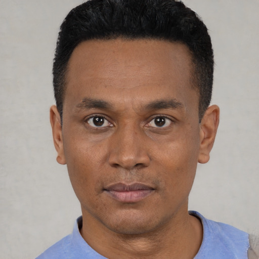 Neutral black young-adult male with short  black hair and brown eyes