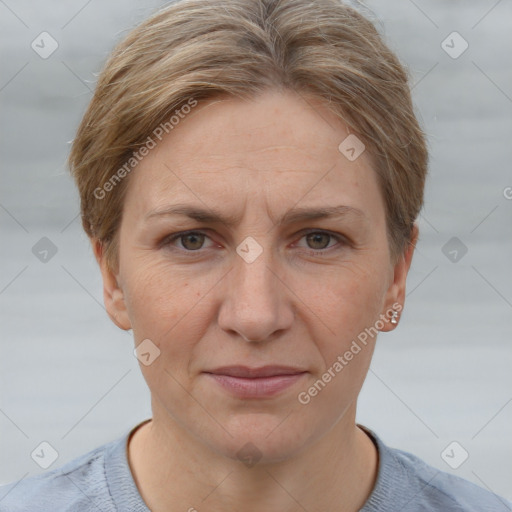 Joyful white adult female with short  brown hair and grey eyes