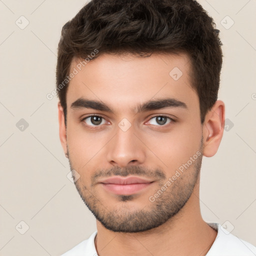 Joyful white young-adult male with short  brown hair and brown eyes