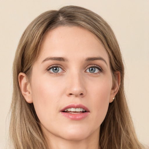 Joyful white young-adult female with long  brown hair and grey eyes