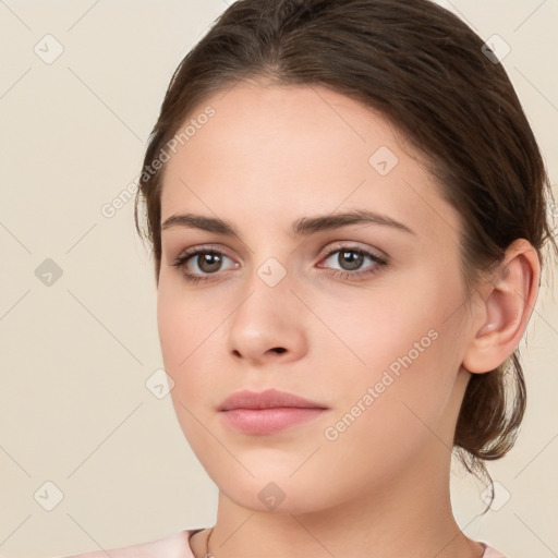 Neutral white young-adult female with medium  brown hair and brown eyes