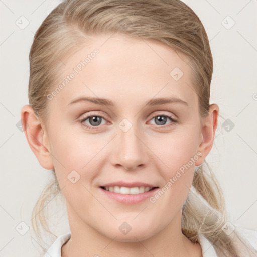 Joyful white young-adult female with medium  brown hair and blue eyes