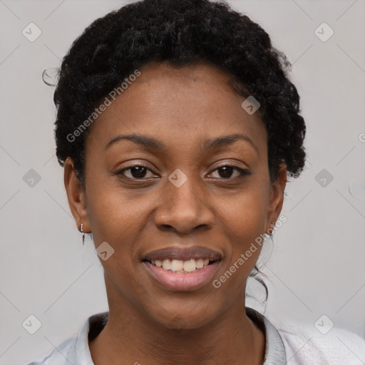 Joyful black young-adult female with short  black hair and brown eyes