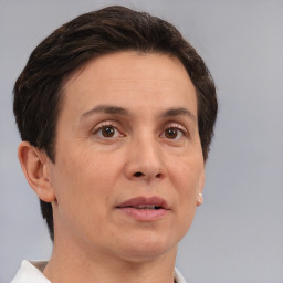 Joyful white adult female with short  brown hair and brown eyes