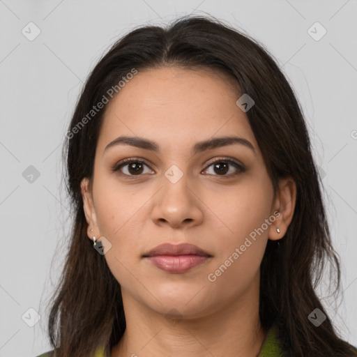 Joyful latino young-adult female with long  brown hair and brown eyes