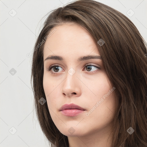 Neutral white young-adult female with long  brown hair and brown eyes