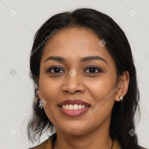 Joyful latino young-adult female with medium  brown hair and brown eyes